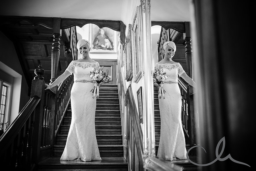 Bride makes her way down the stairs at St Augustine's Priory