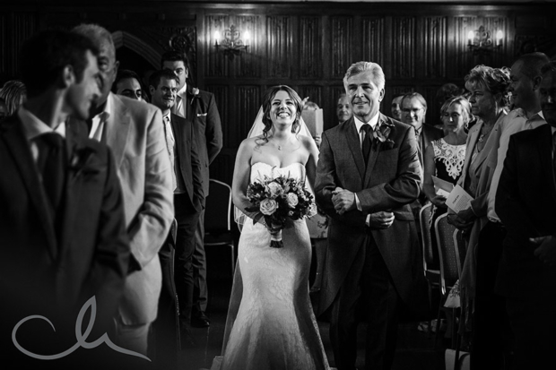 Bride walks down the Isle with her father at Lympne Castle