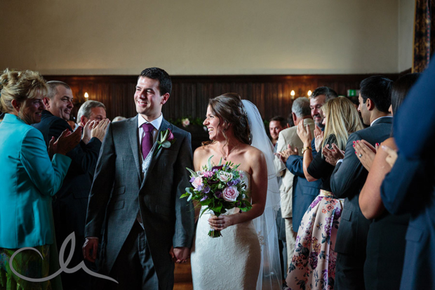 the newlyweds exit the aisle at Lympne Castle