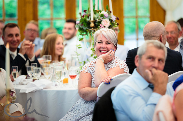 guest reacts to the speeches at Lympne Castle Wedding