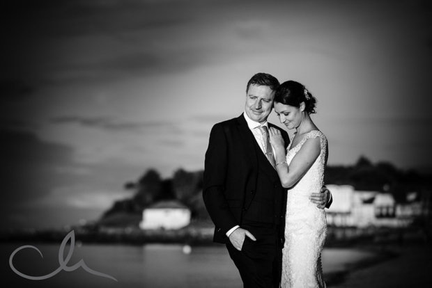 newly wed couple have romantic photos at Whitstable Beach