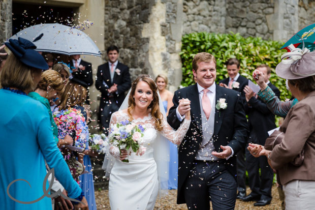 newlywed couple are showered with confetti at St Edmunds Chapel Canterbury Kent
