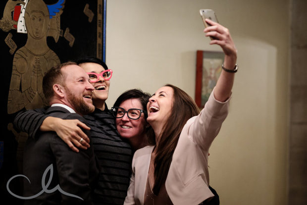 Guests take selfies at Lympne Castle Wedding reception