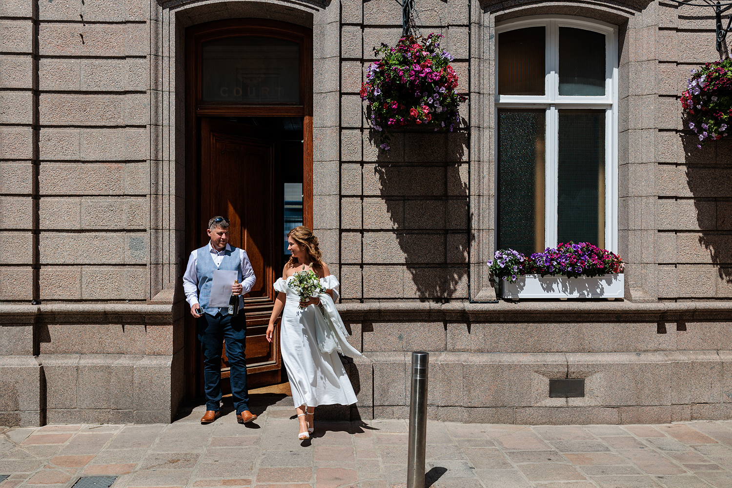 The newlyweds leave The Old Magistrates Court, St Helier, Jersey after their elopement Wedding